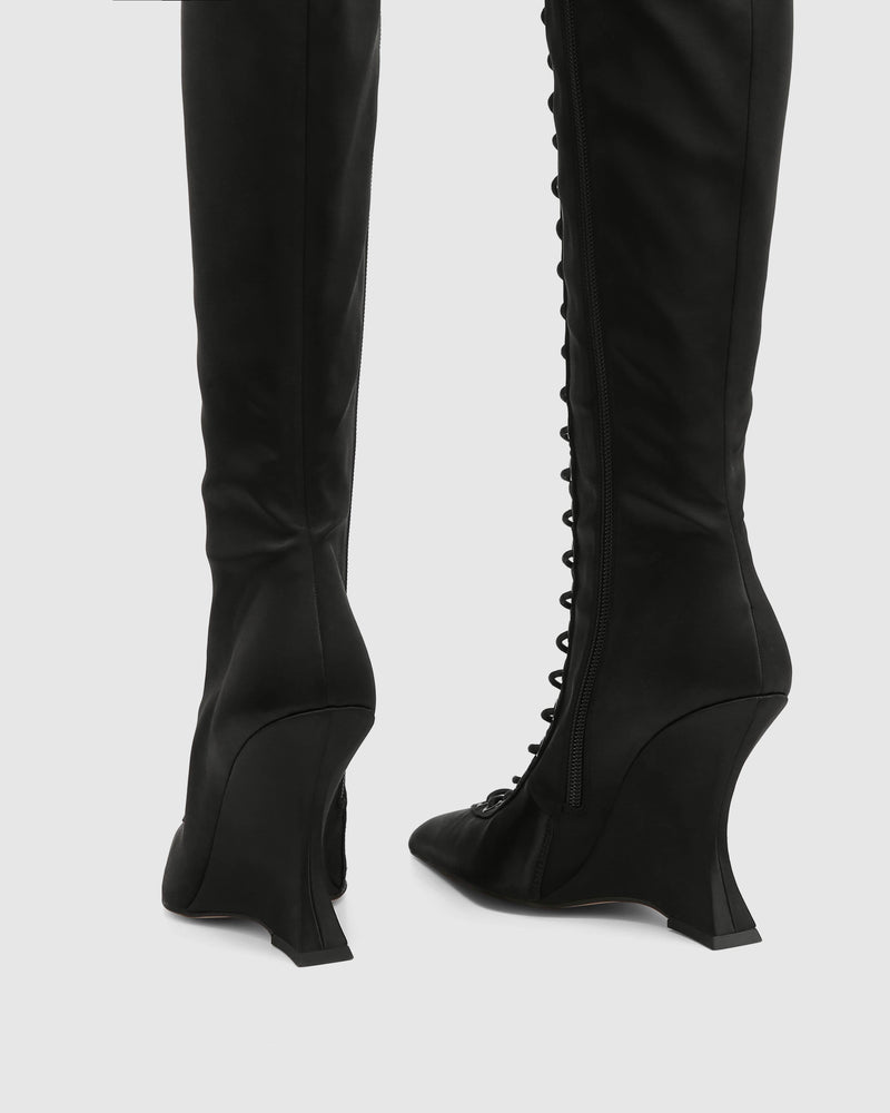 Lacy black satin lace-up knee-high wedge boot by Naked Wolfe